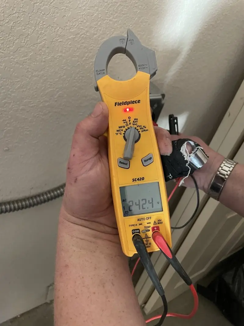 Voltage testing with clamp meter during Electrical Installation Services in Richmond